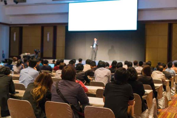 audiences-sitting-listening-speackers-stage.jpg